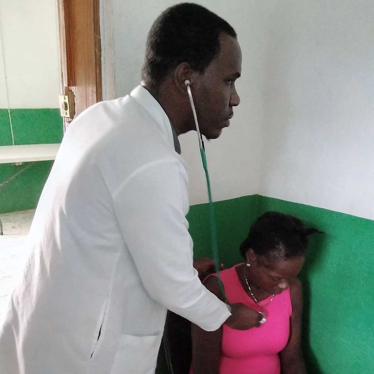 A physician examining a patient.