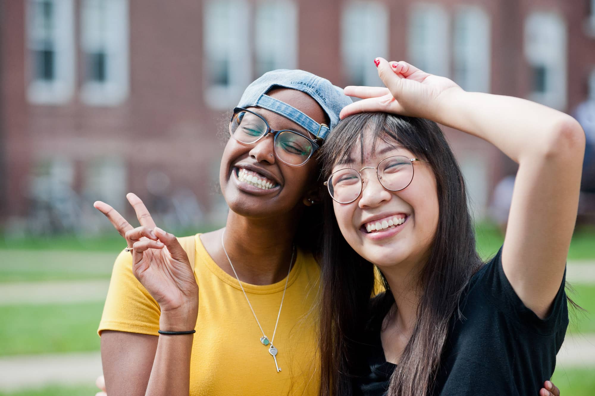two students making peace signs