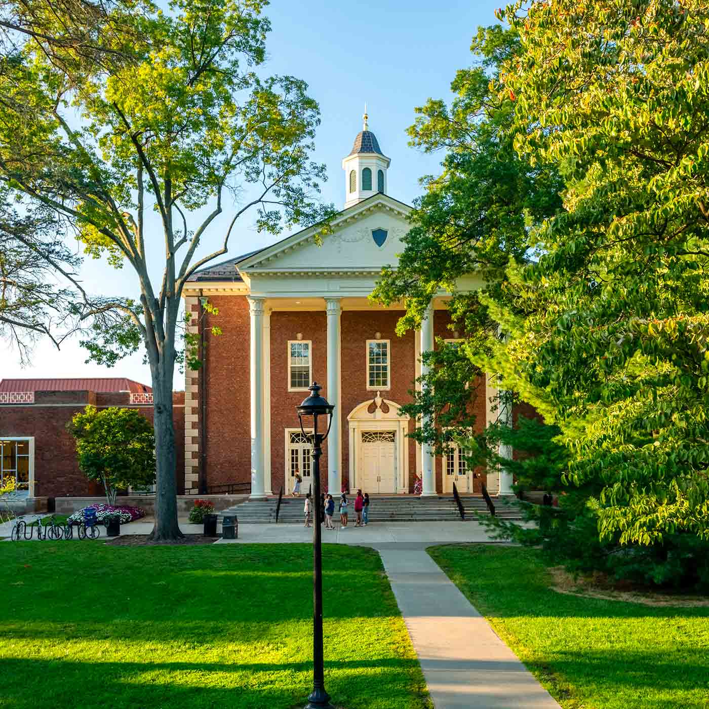 A view of Gordon Commons, a large brick building with white columns