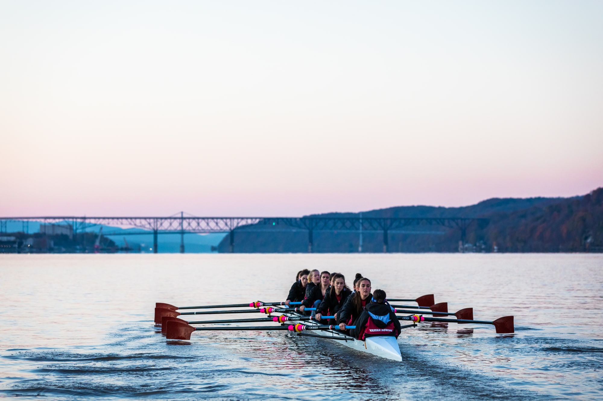 A group of students row on the Hudson River early in the morning