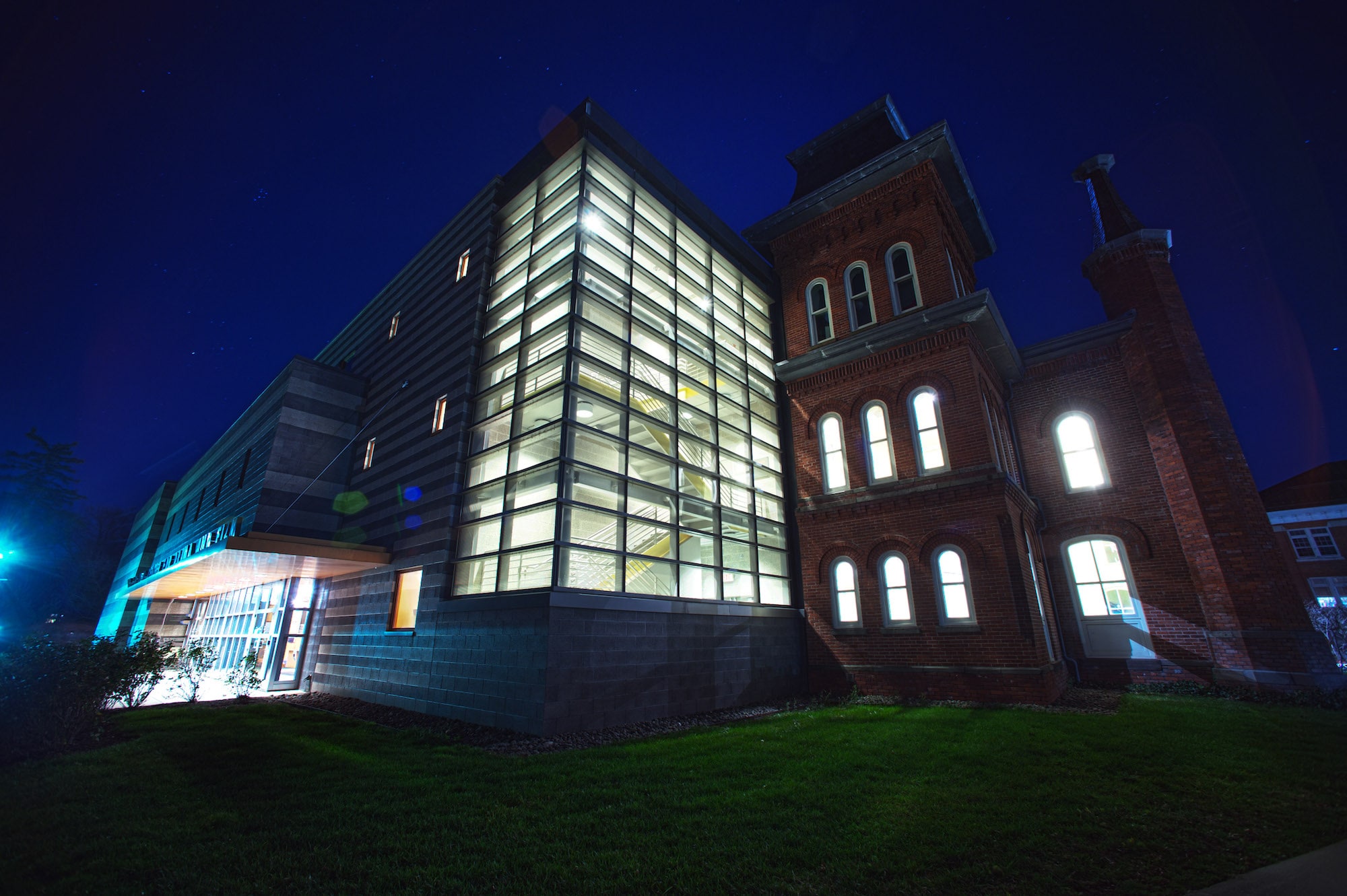 A photo taken at night of the Volgelstein Center for Drama and Film, facing the north corner