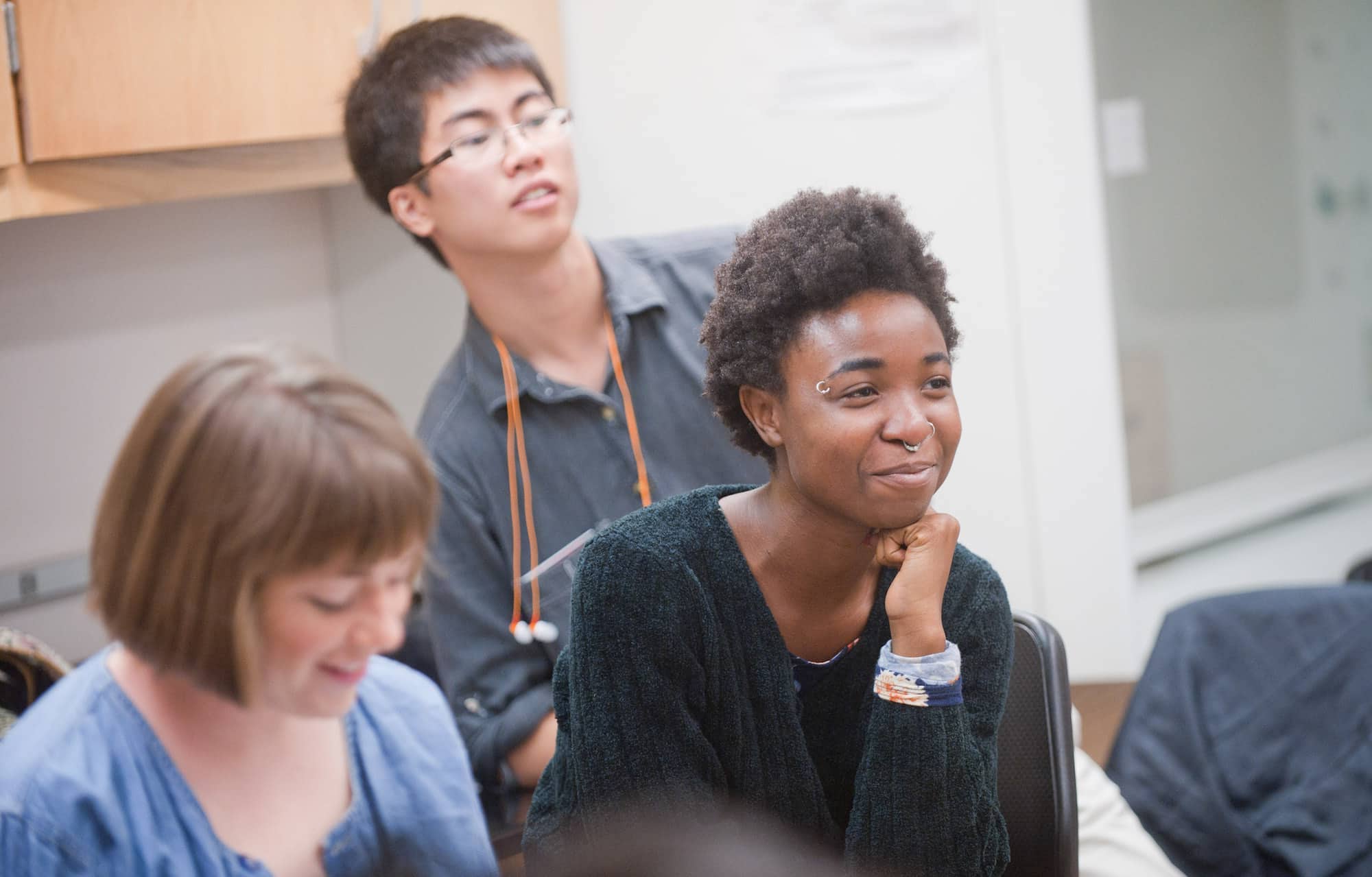 Students sitting in a class listening