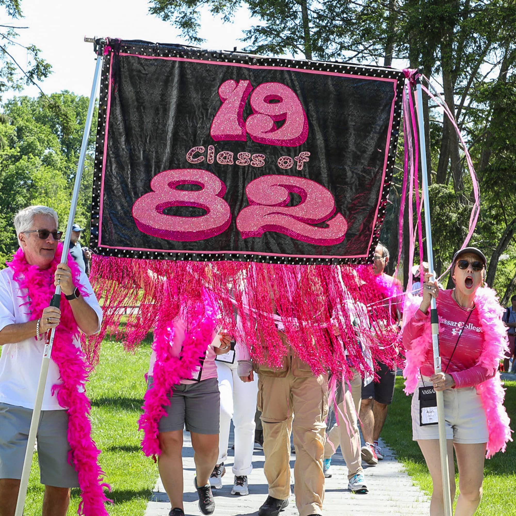 People holding up Vassar Class of 1982 Banner at Reunion.