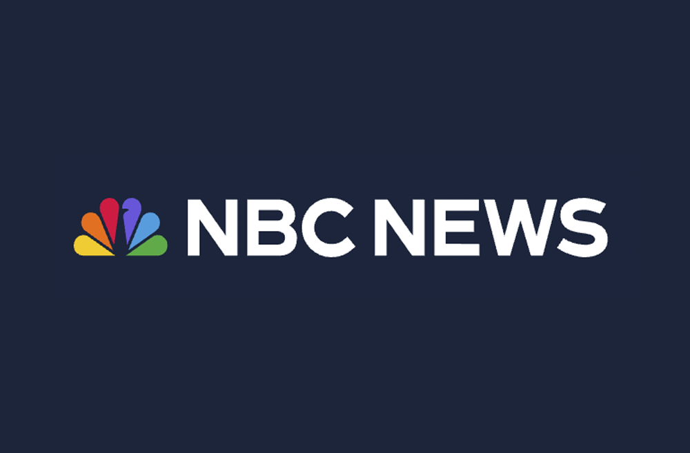 NBC News logo with multicolored peacock icon and white text on a dark blue background.
