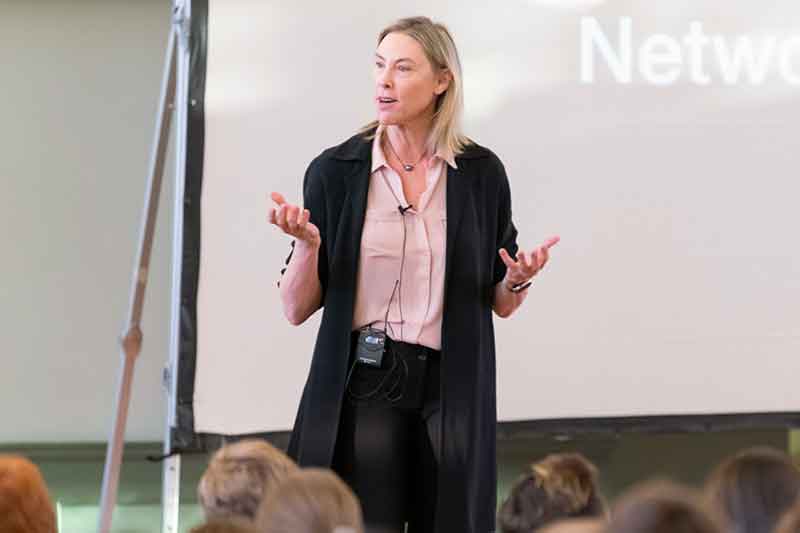 Speaker in front of an audience at a networking event