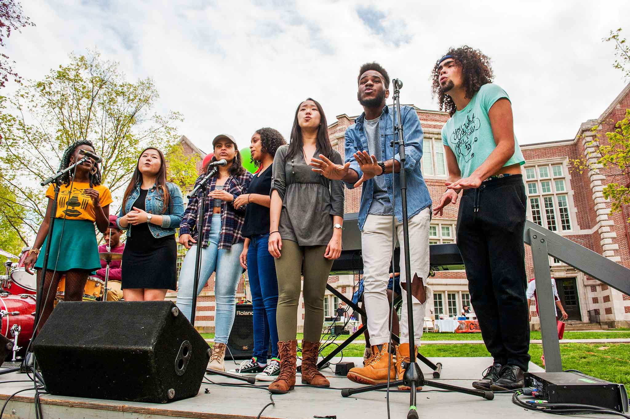 Students singing on stage