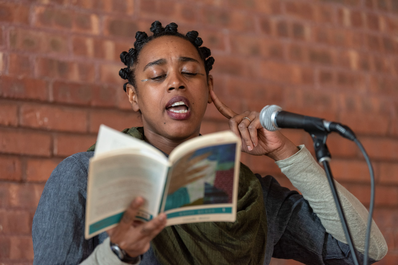 A person reads at MLK breakfast event