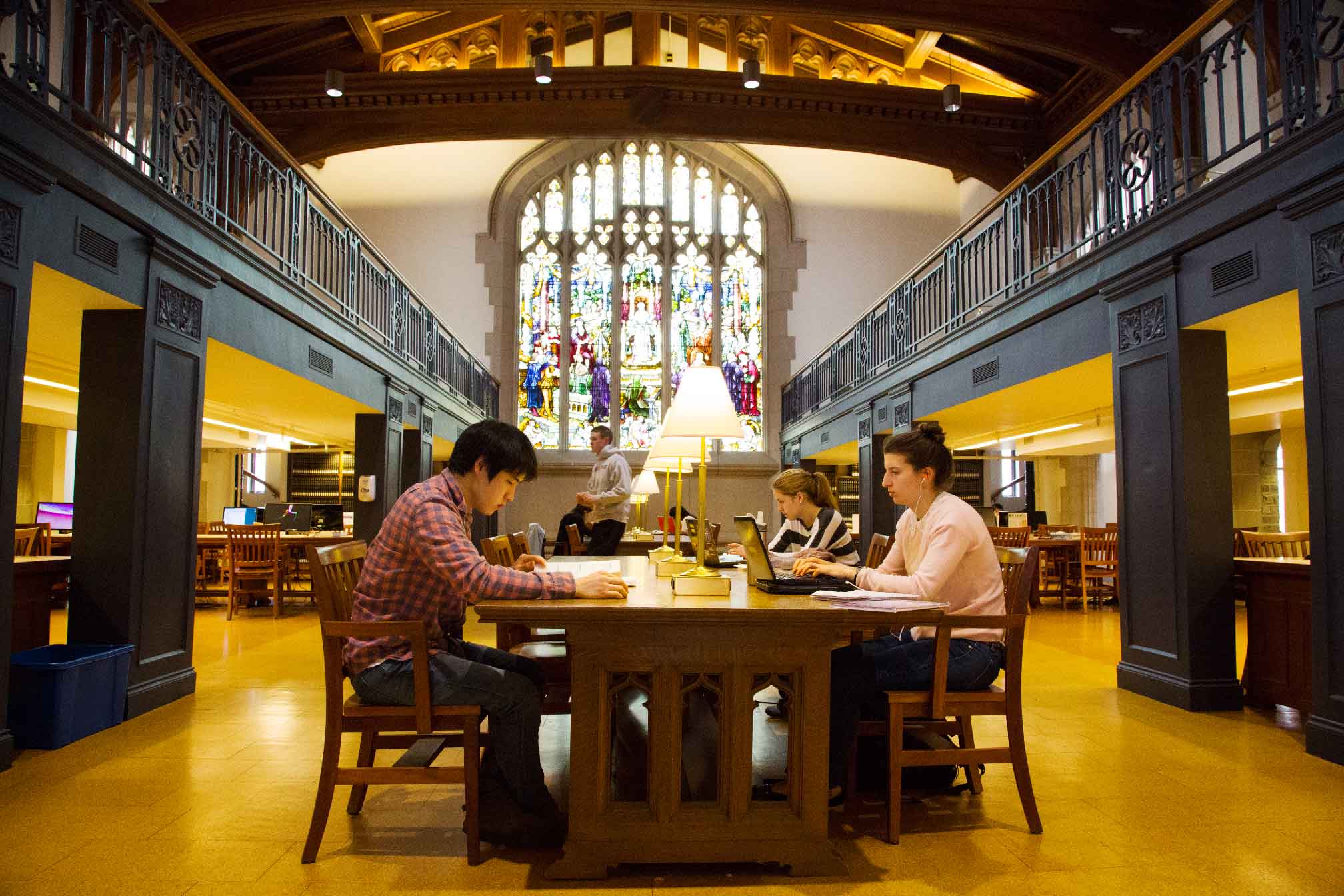Image of students studying at a table in the library