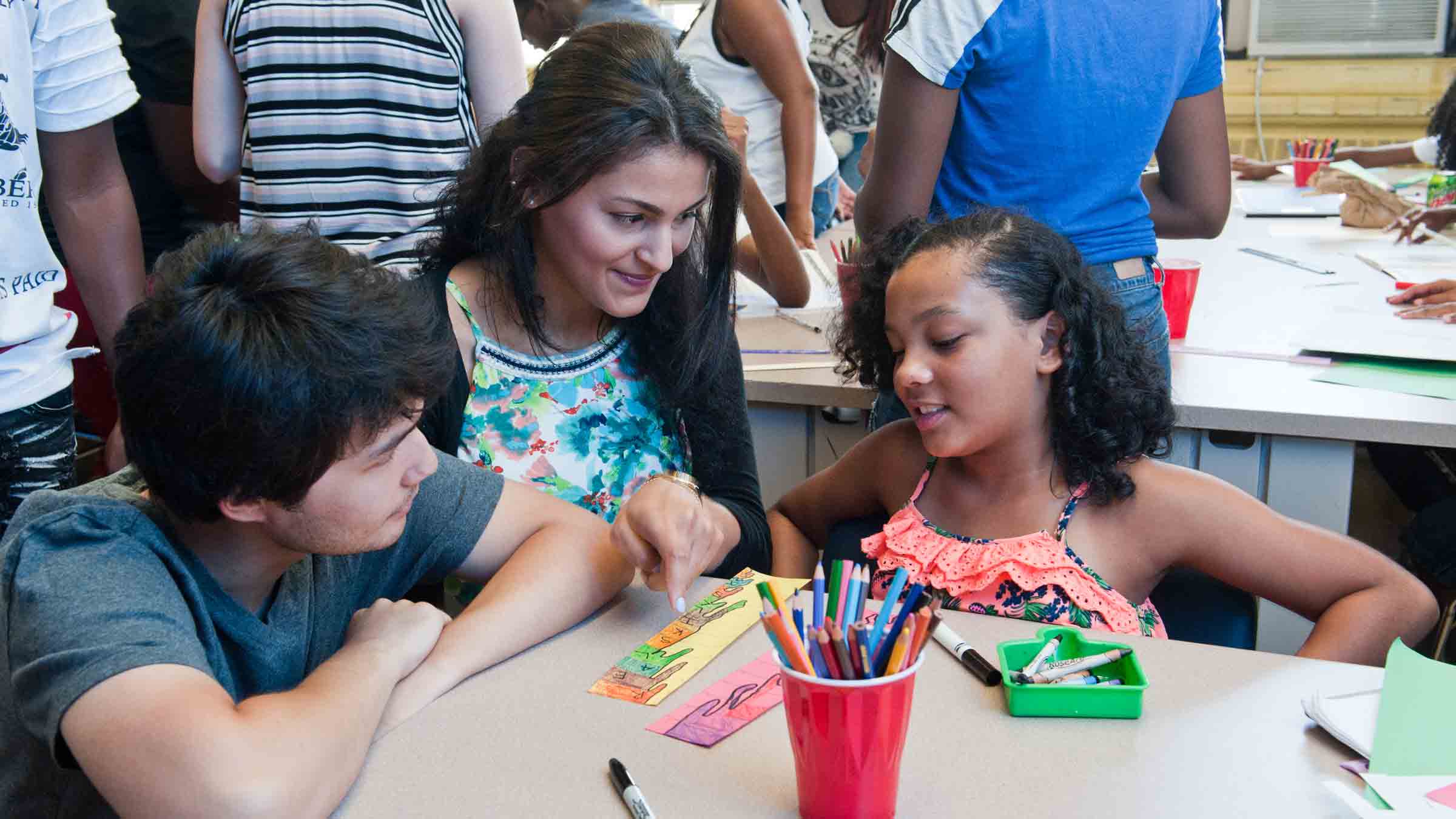 A Vassar student works with children