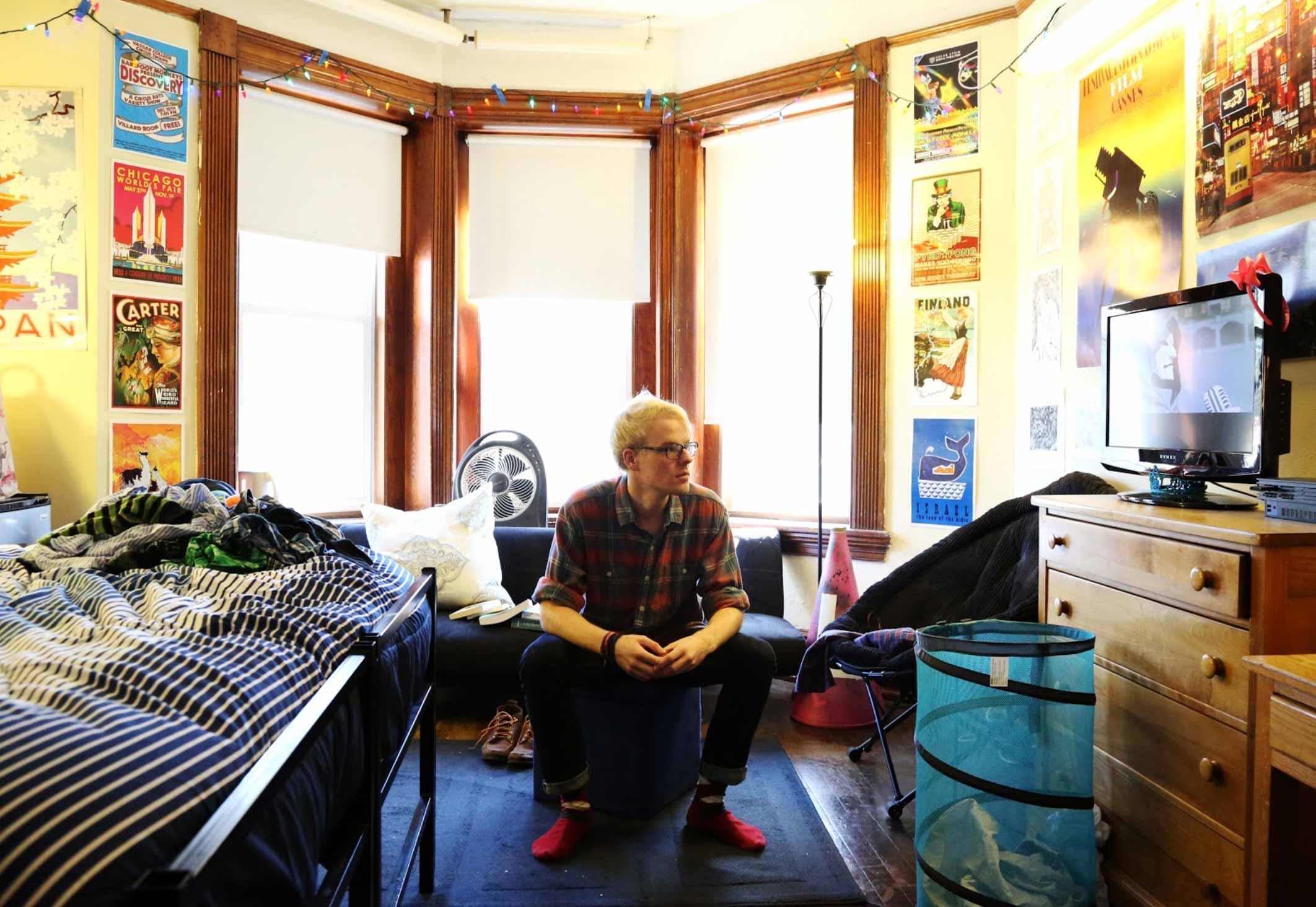 Image of a student sitting in their dorm room