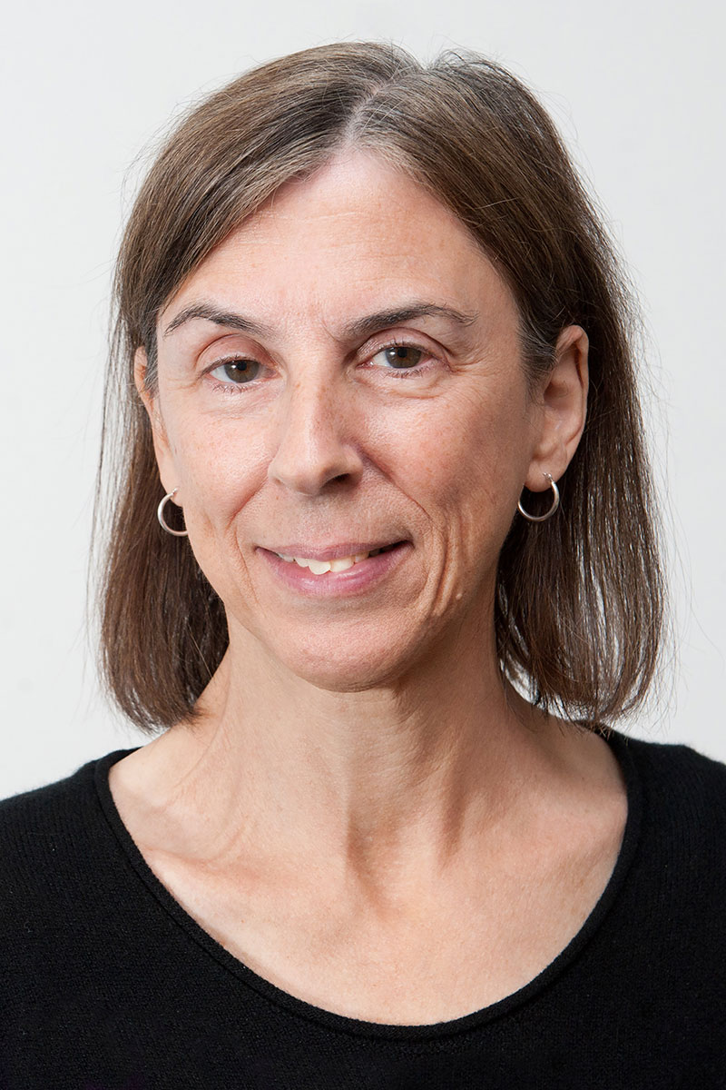 Janet Andrews wearing a black shirt against a light background.