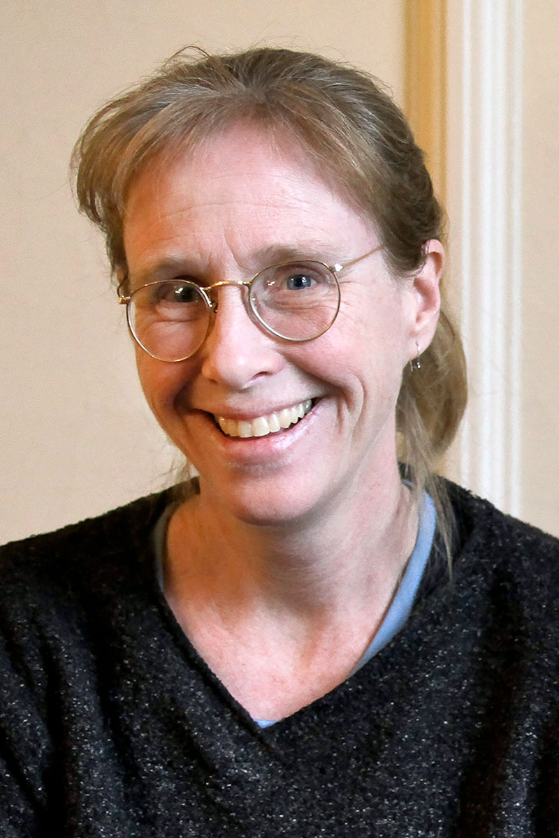 Mary Ann A. Cunningham wearing a black sweater against a light background.