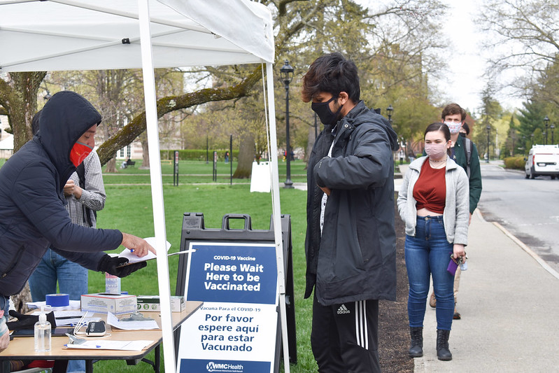 Students at a COVID-19 vaccine booth