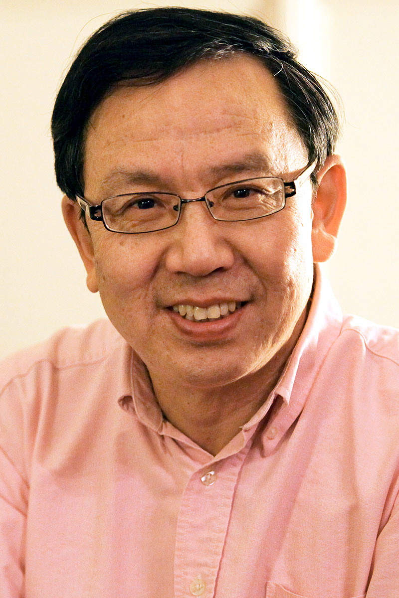 Wenwei Du wearing a pink collared shirt. 