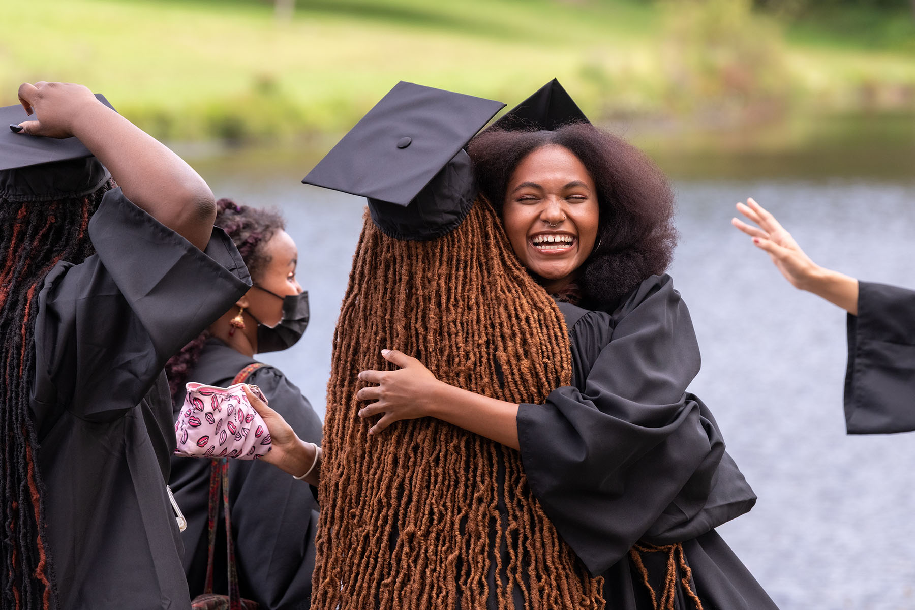 Students greet each other at Convocation, happy to be together in person.