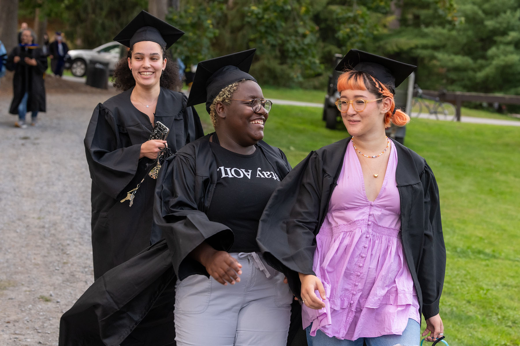 Friends greet each other before Convocation.