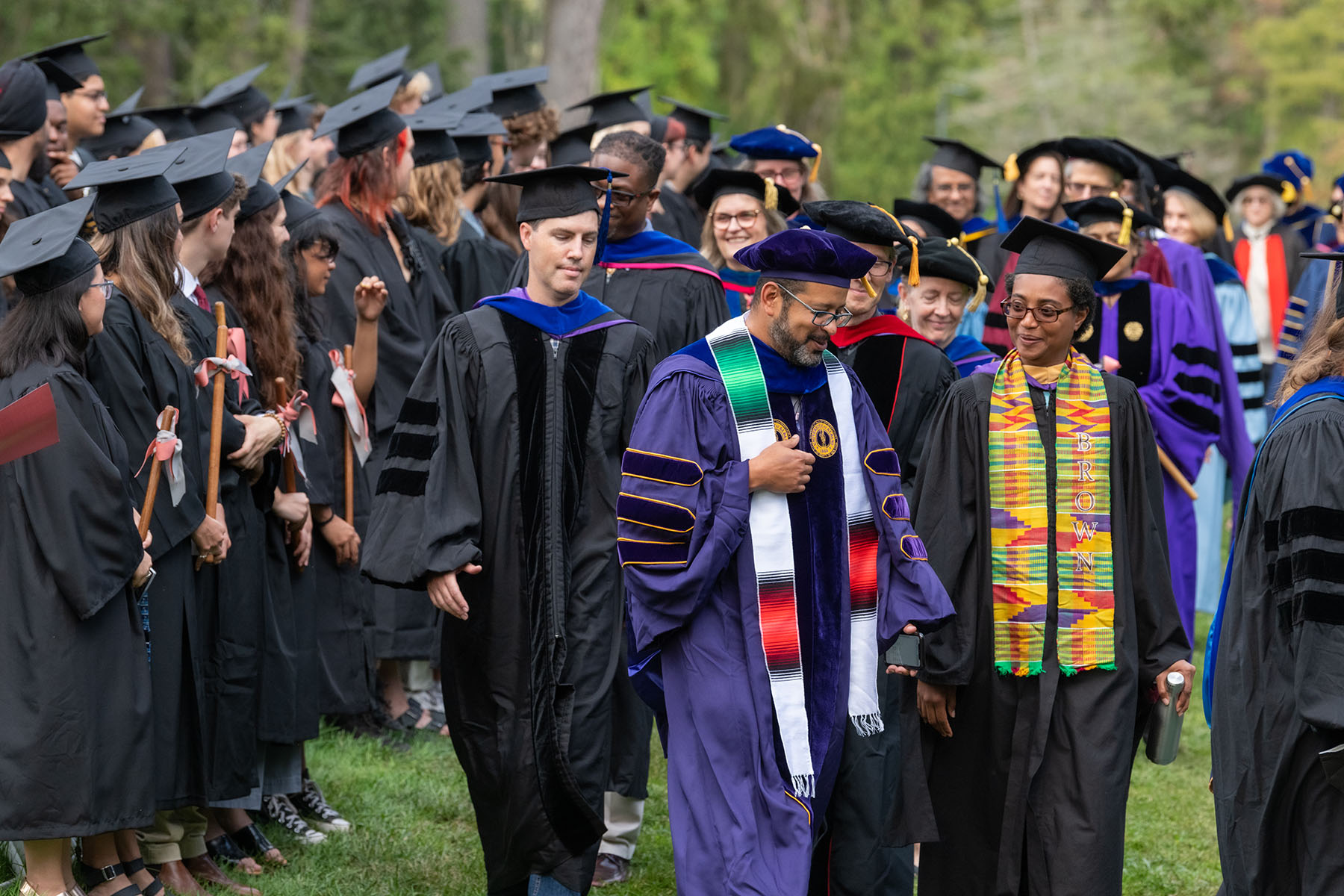 Faculty and administrators march in.