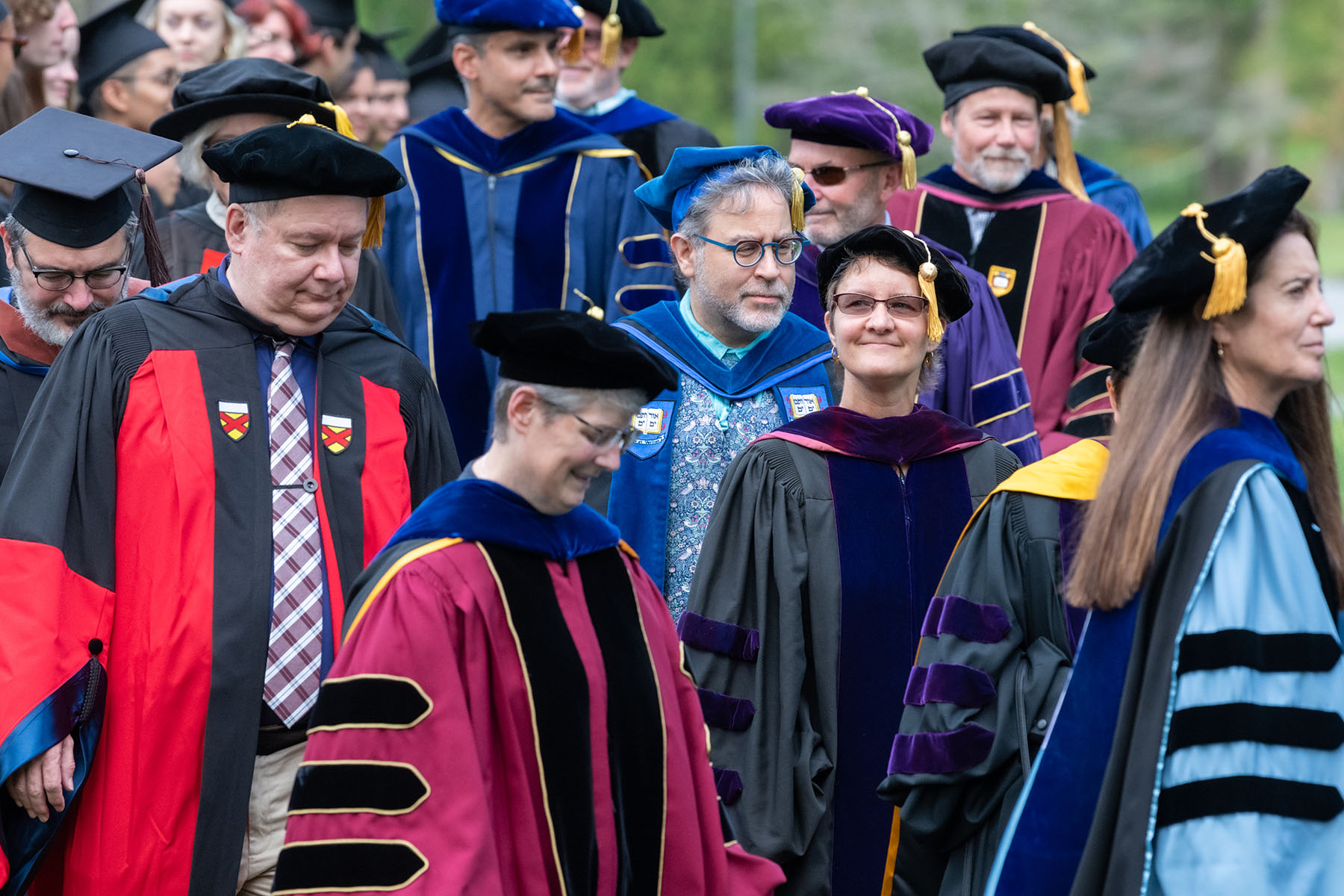 Faculty and administrators make their way to the dais.