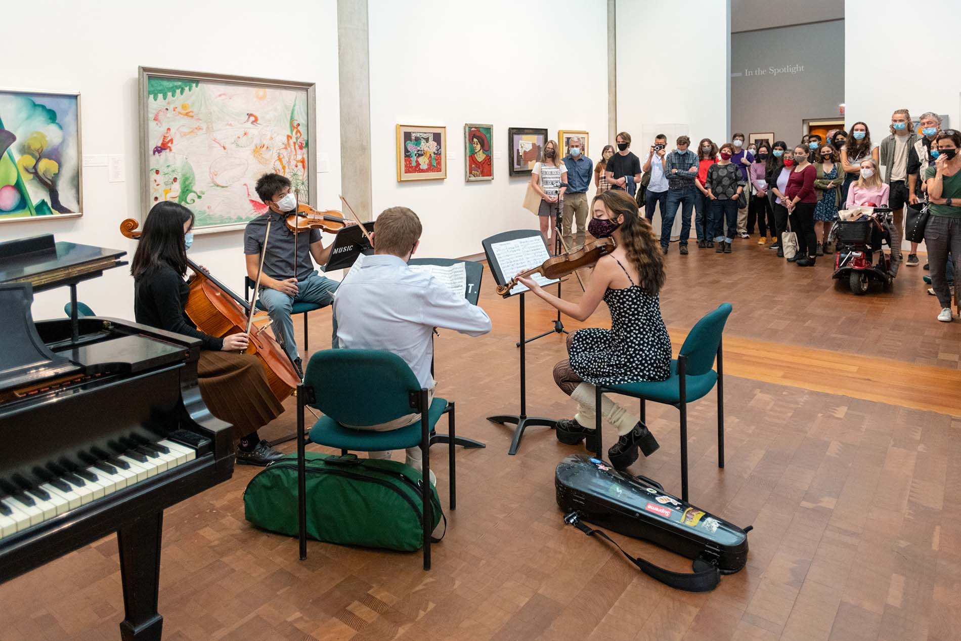 Families listen to live chamber music in the Loeb Art Center.
