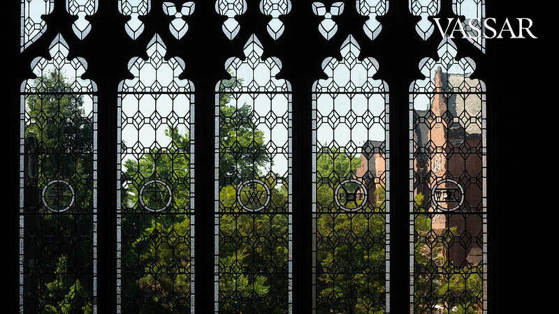 Library windows and view of campus beyond