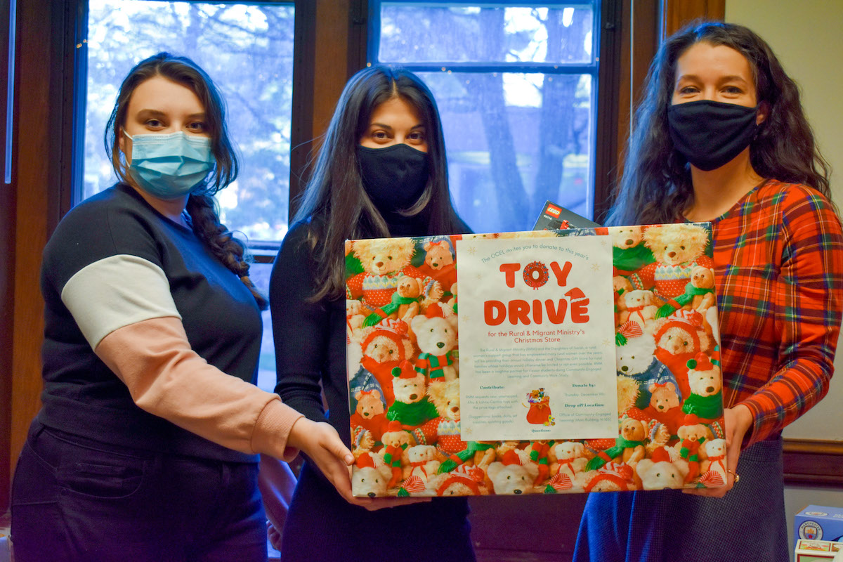 The (masked) faces behind the Office of Community Engaged Learning Toy Drive’s success (left to right): Megan Reyes, President's Administrative Fellow; Amanda Goodman, Administrative Assistant, and Jean Hinkley, OCEL Assistant Director.