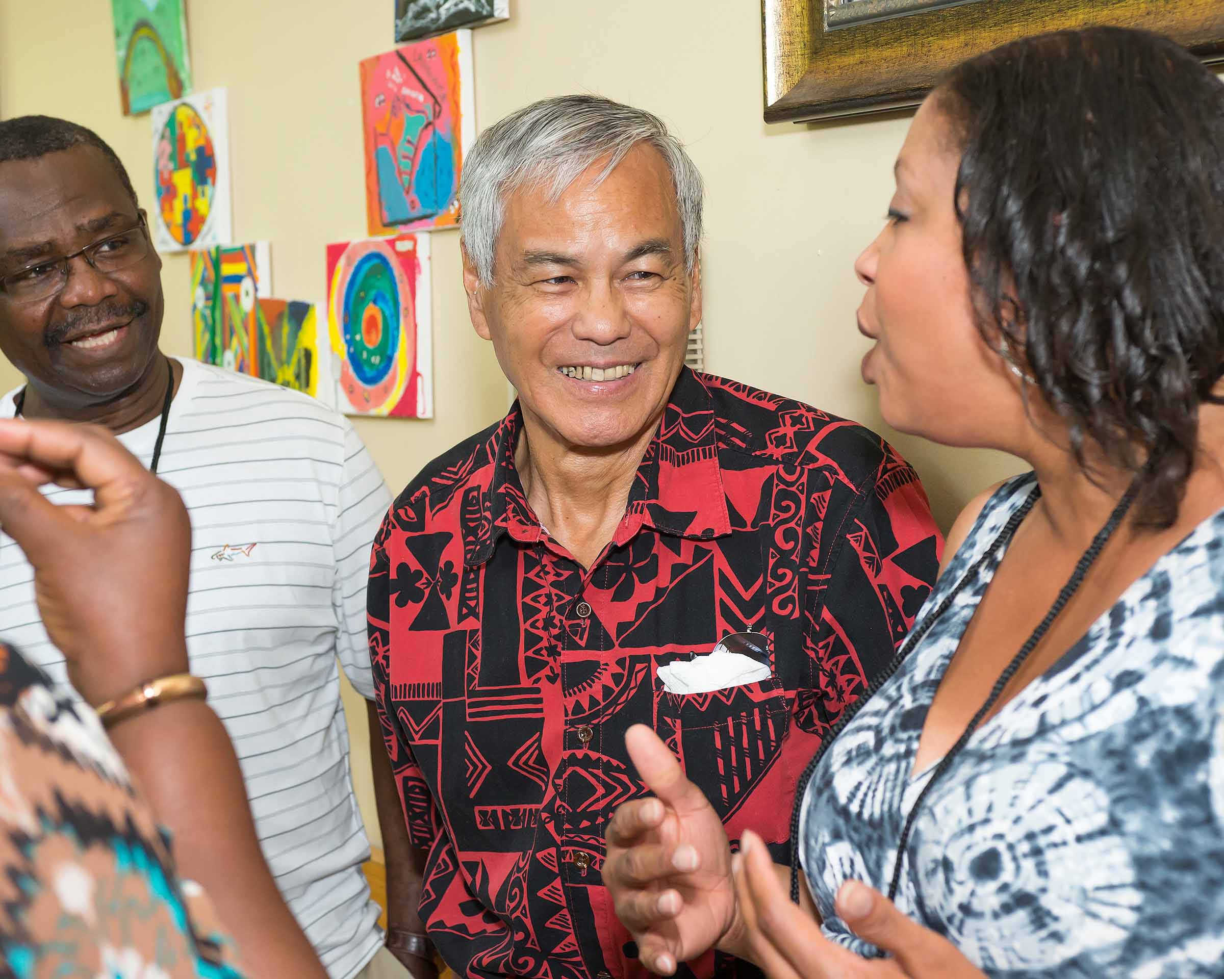 Prof. Mamiya chats with former students Kofi Dodi ’80 (left) and Danyale Ury ’90 at a Vassar reunion in 2015. 