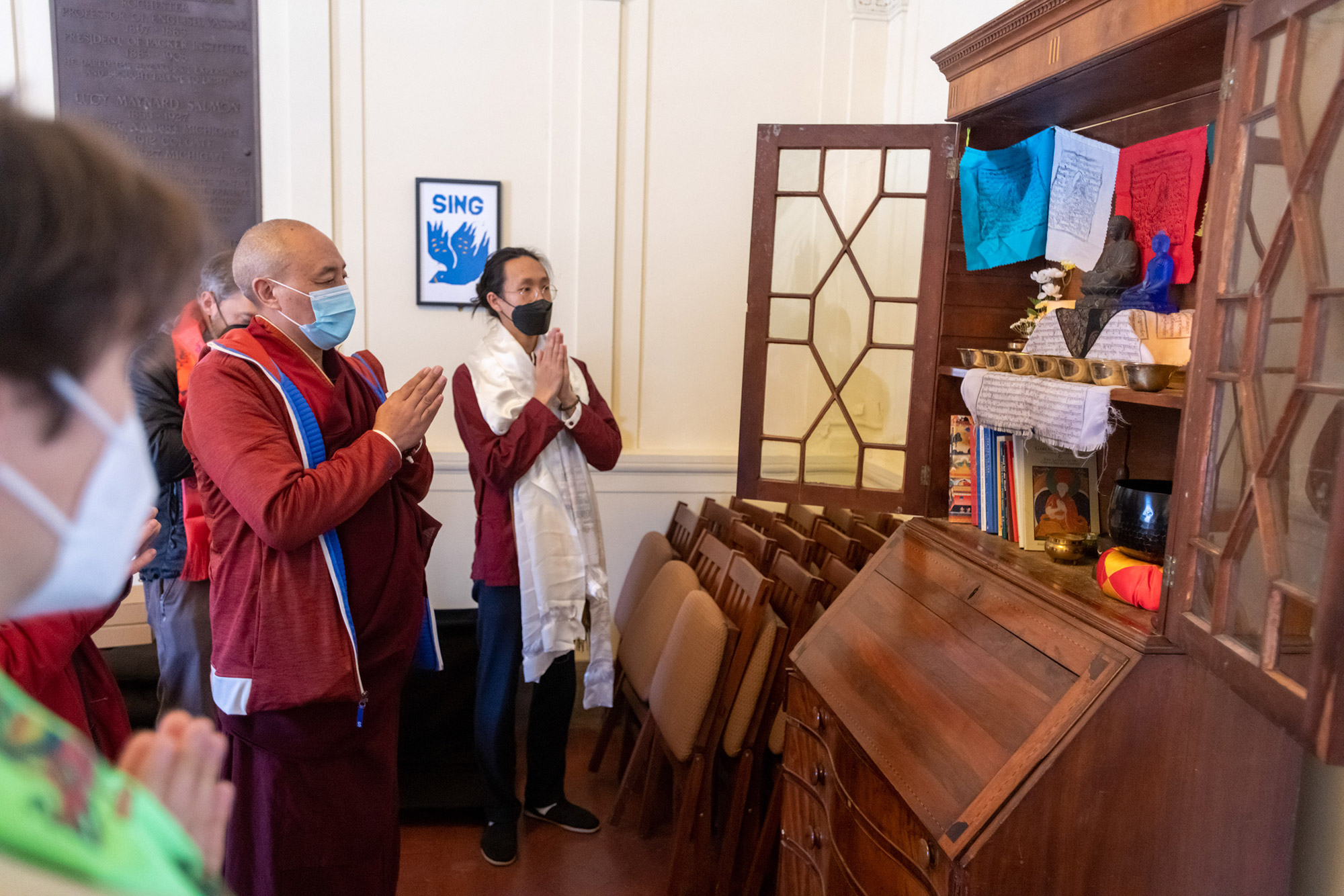 Before the blessing ceremony in the museum, Lama Topgyal visited the altar of Buddhist Sangha, Vassar’s student Buddhist organization. Far right: Edward Cai ’22, President of the Buddhist Sanga.
