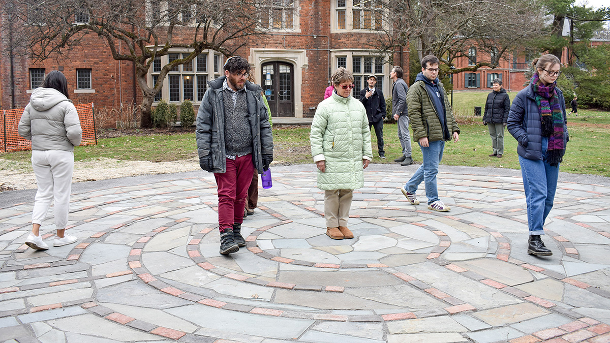 Rabbi Bryan Mann, Rachlin Director of Jewish Student Life (far left), joins Professor of Earth Science Jill Schneiderman (second from left) and students Christian Wilson ’23 and Ellie Whiteman ’24 walk on the completed labyrinth.