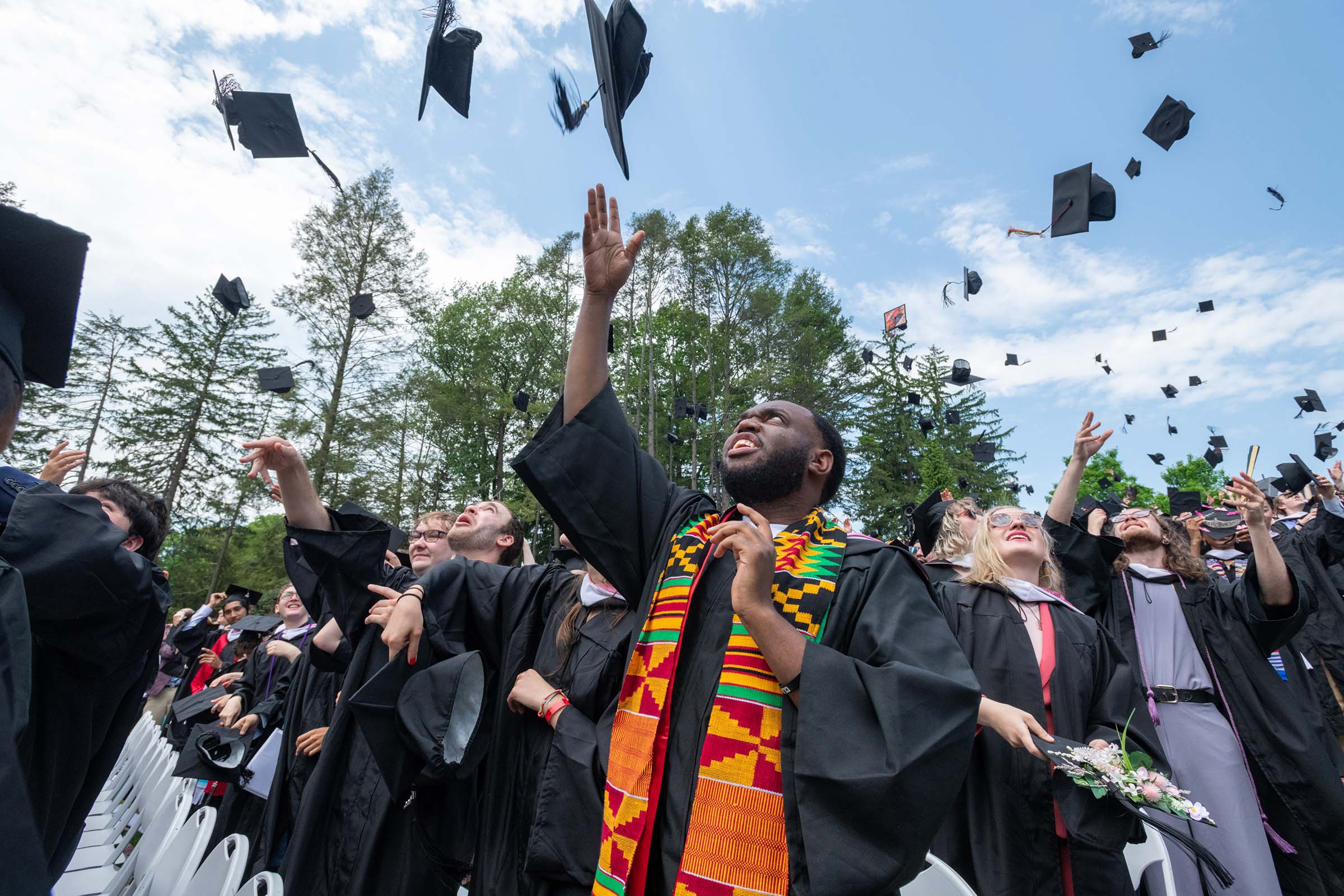 Students celebrate the conclusion of the ceremony with a long-awaited hat-toss.