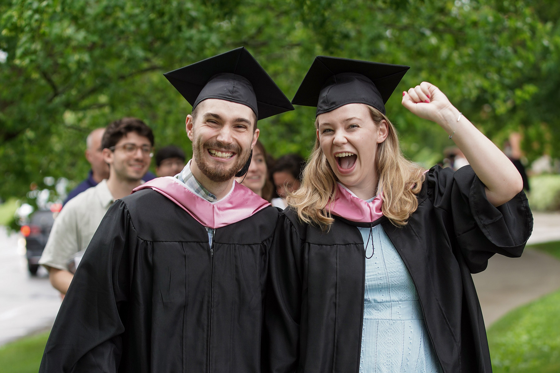 Young alums take a moment to celebrate.