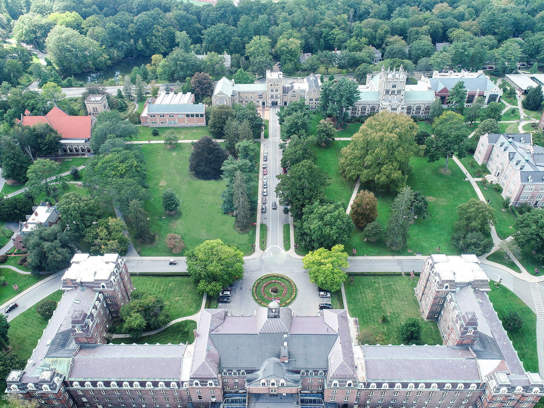 J. C. Olmsted’s central green, seen from over Main Building looking west, and framed by “working buildings”, as he recommended. (Photo: Chad Fust, September, 2021)