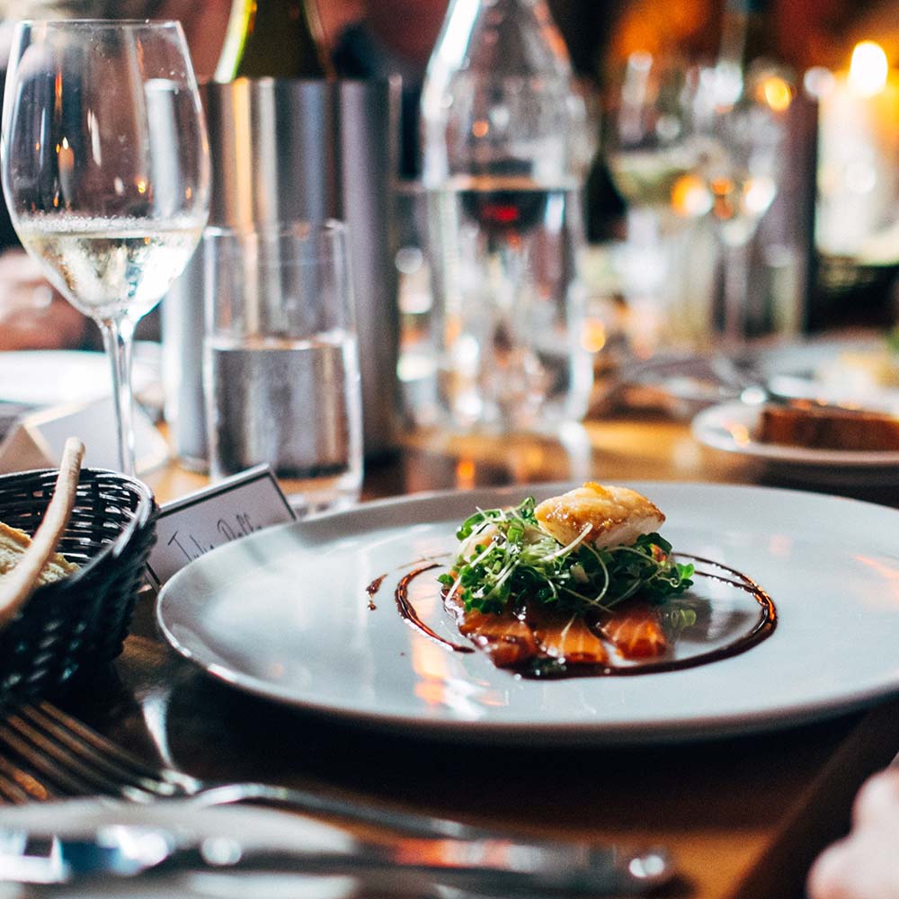 a plate of food and wine glasses