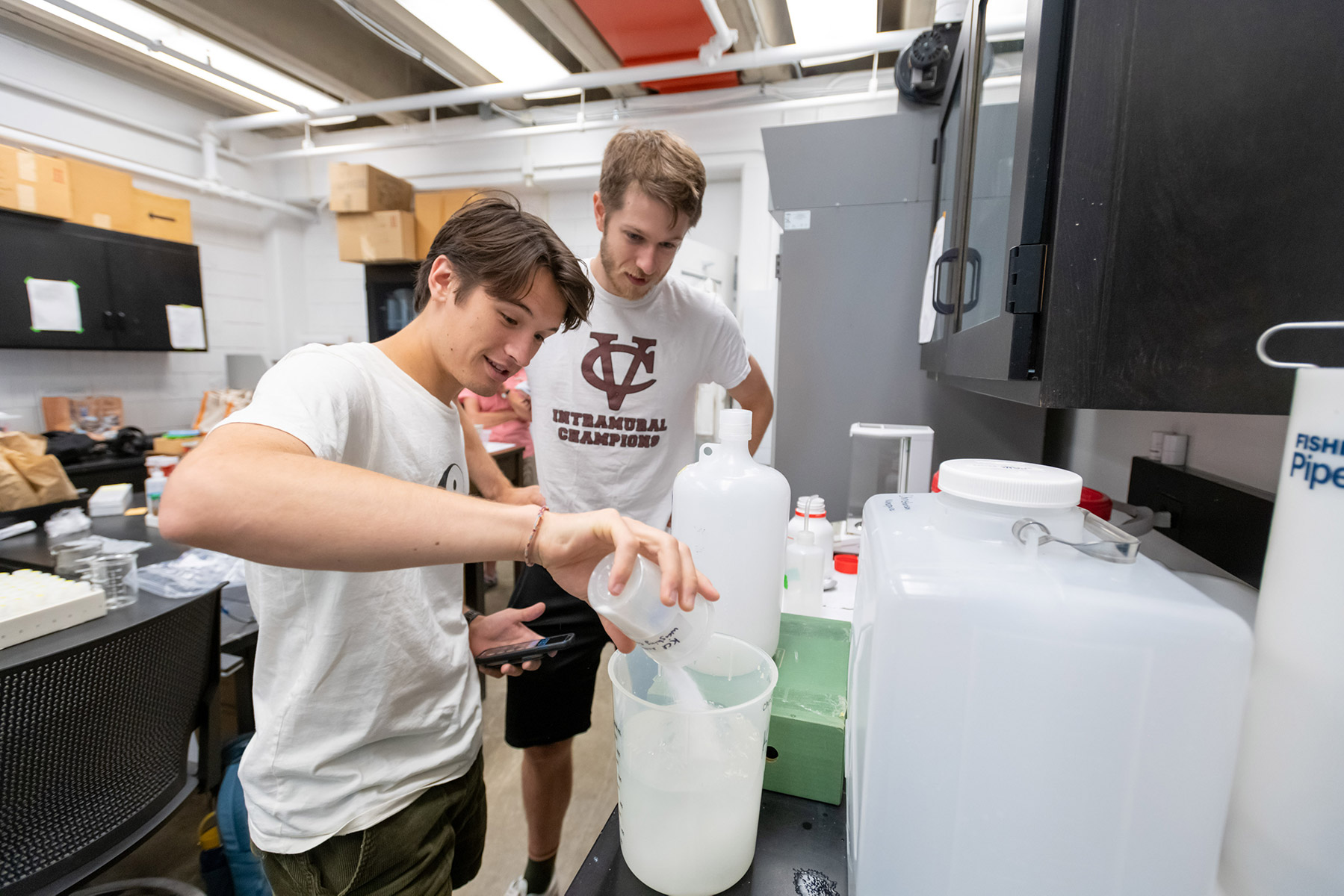 Andrew Blackburn ’24 (left) and Jackson Buettner ’23 tested the composition of soil from several forests to assess the environmental impact of an abundance of deer.