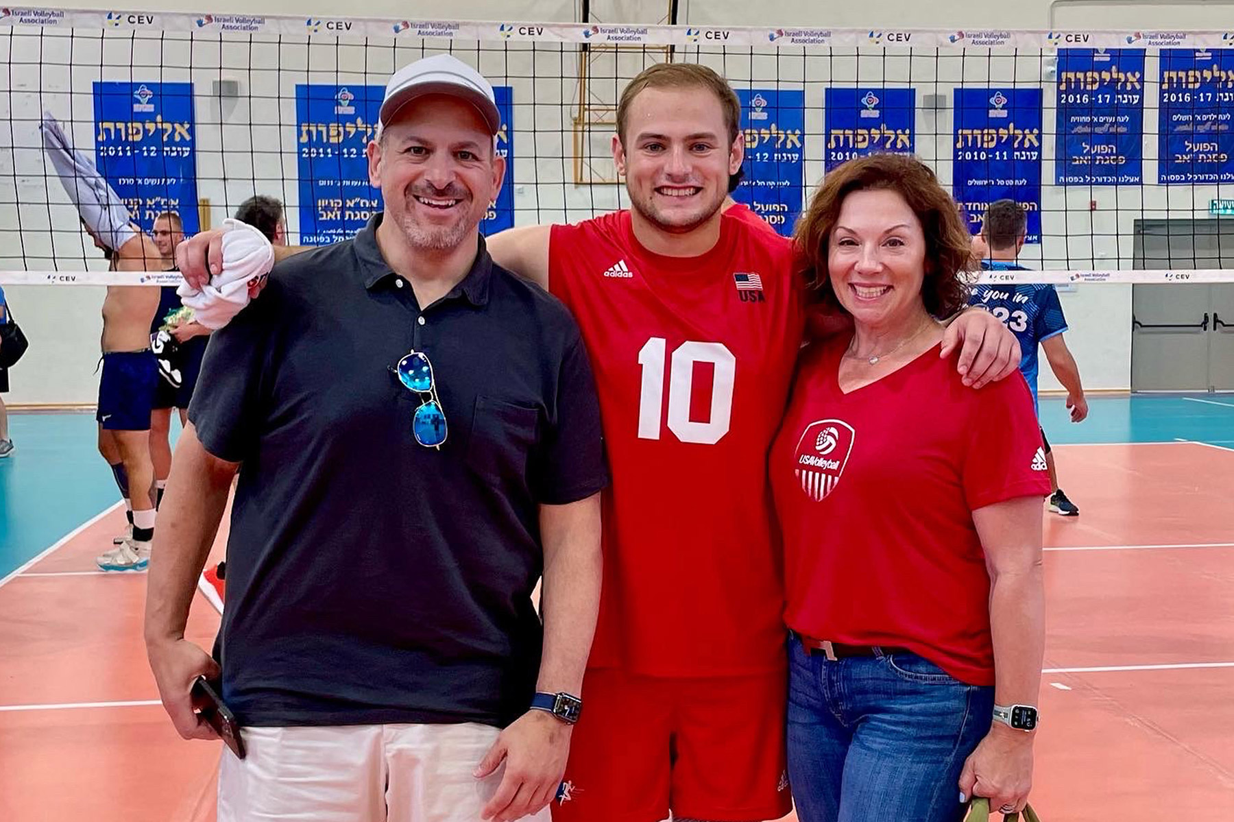 Jake Kaplan (center) with his father, Jeff, and mother, Erin, at the 21st Maccabiah Games