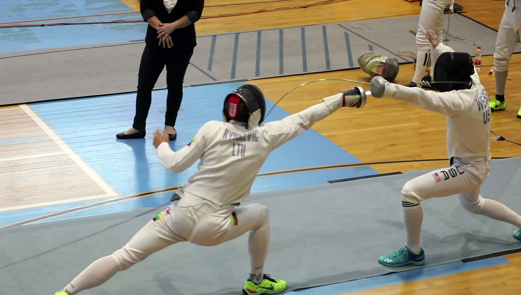 In action: Eli Weise (right) scores a point fencing en route to a bronze medal at the 21st Maccabiah Games