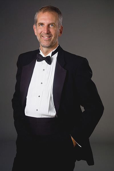 Music faculty member Robert Osborne wearing a tuxedo.