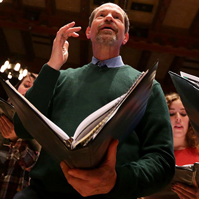 Drew Minter leading a rehearsal of the Madrigal Singers