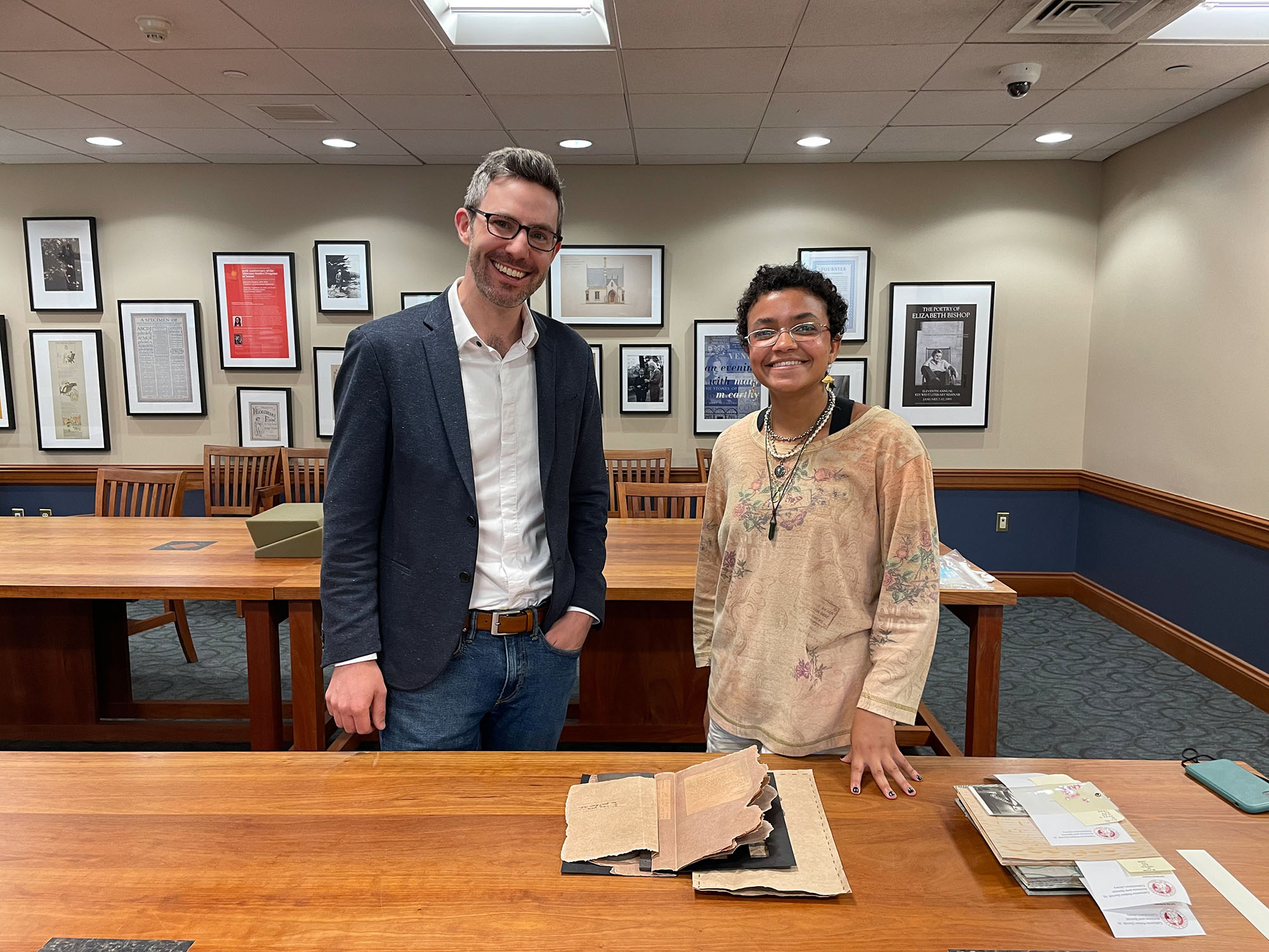 John Murphy, the Loeb’s curator of prints and drawings, and Ford Scholar Carissa Kolcun pose with 11033, an artist’s book that chronicles the story of Mary Morst, who gave birth to twins while she was incarcerated in a Virginia prison in 1913.
