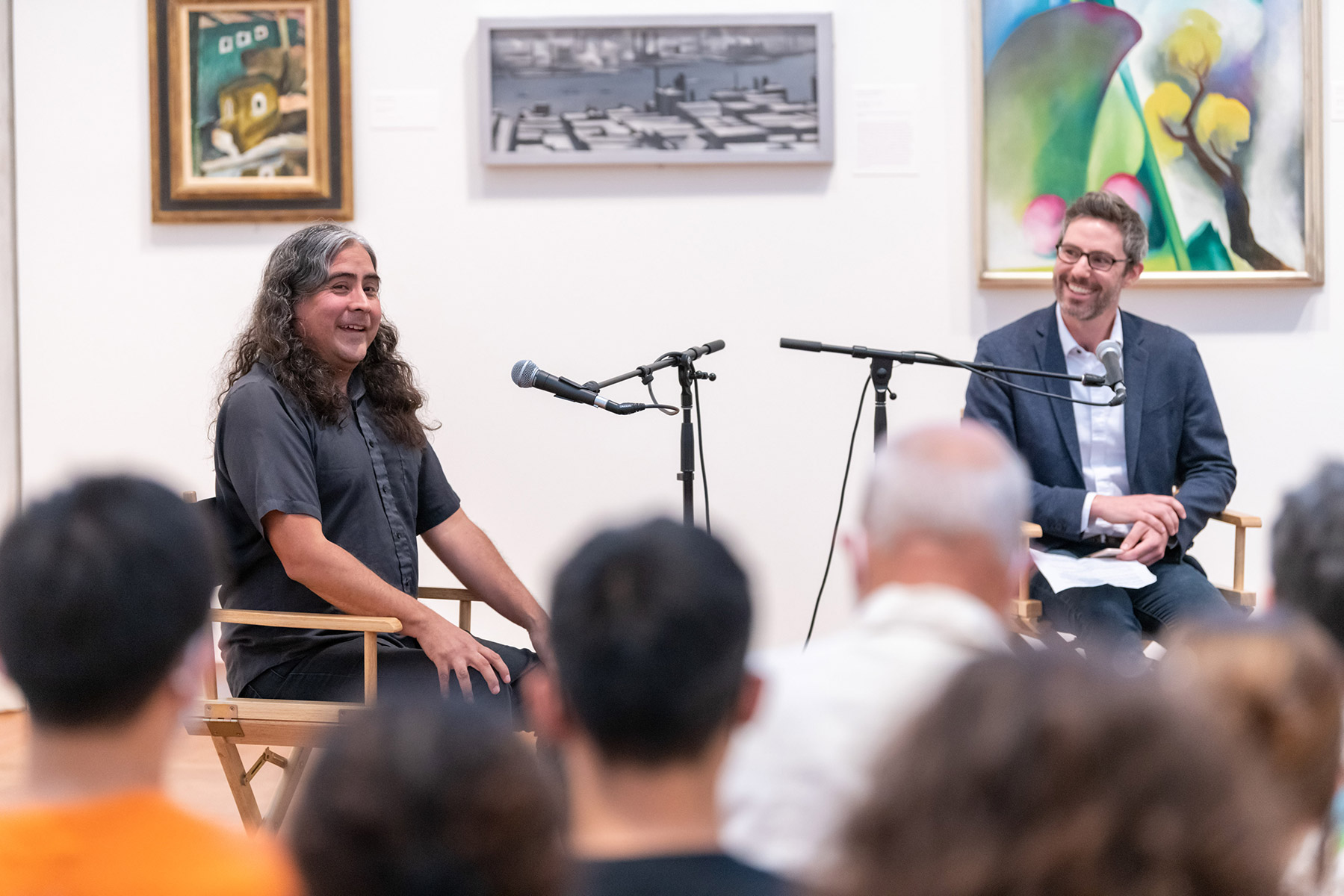 Composer Raven Chacon (left) engaged in a conversation with John Murphy (right), the Loeb’s Curator of Prints and Drawings, prior to a performance of one of his latest works, Hose Notations.