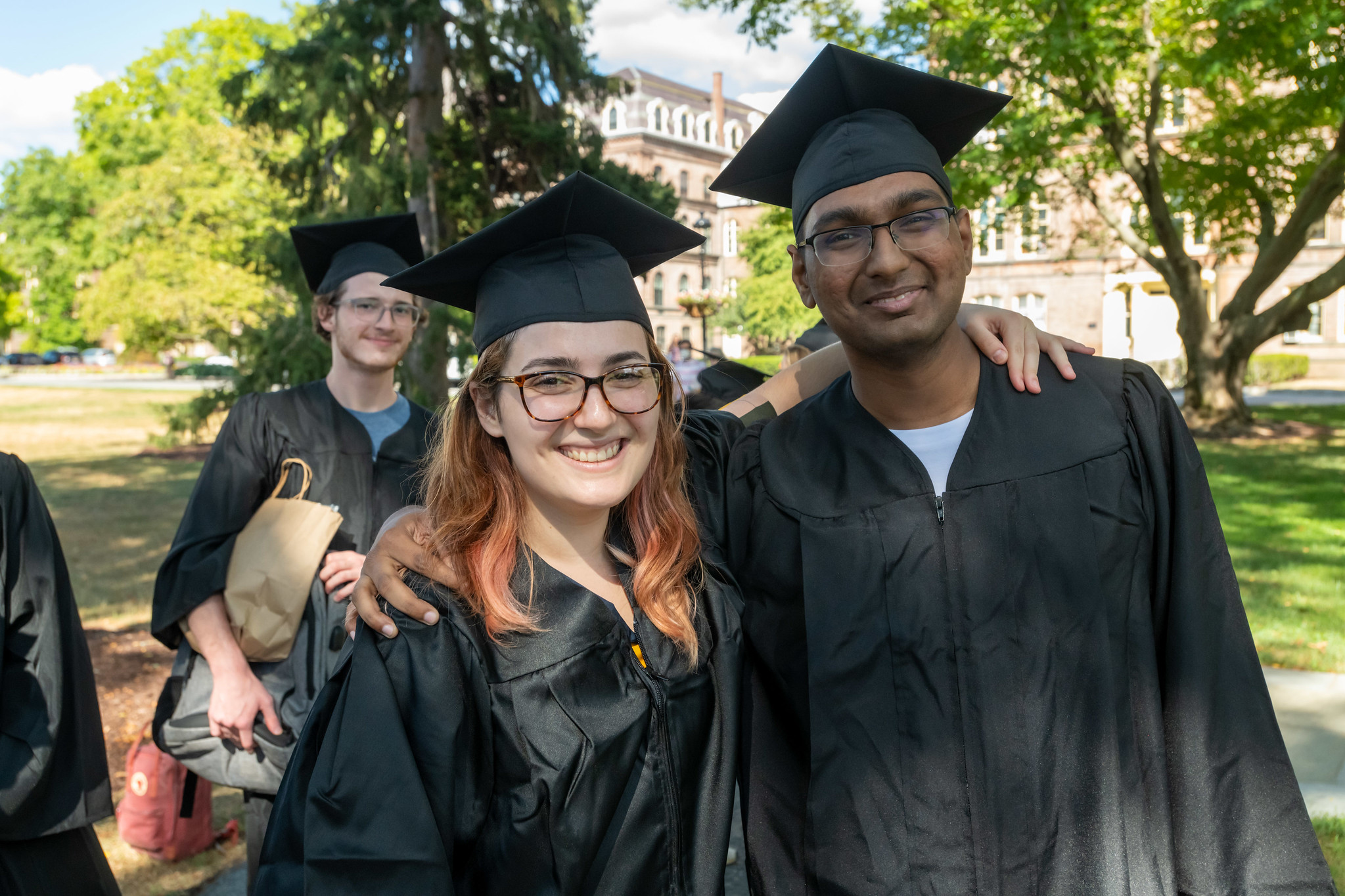 Seniors in caps and gowns on the Chapel Lawn