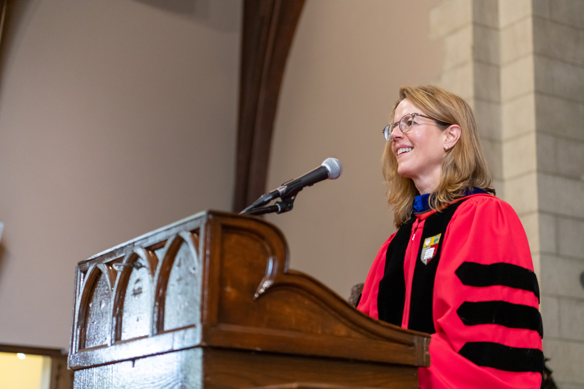 Nancy Bisaha standing at the podium