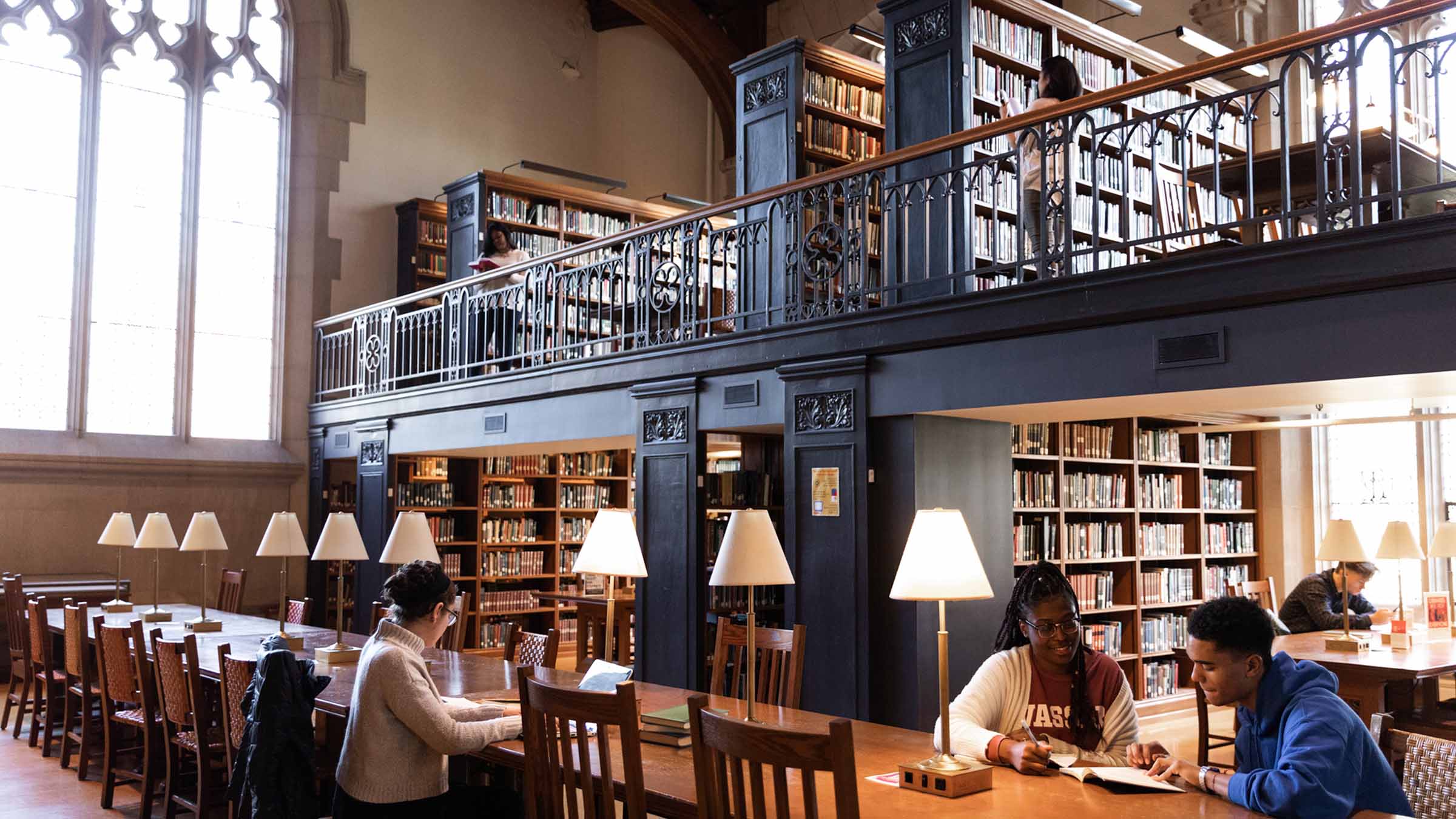 People sitting at tables in the Thompson Memorial Library