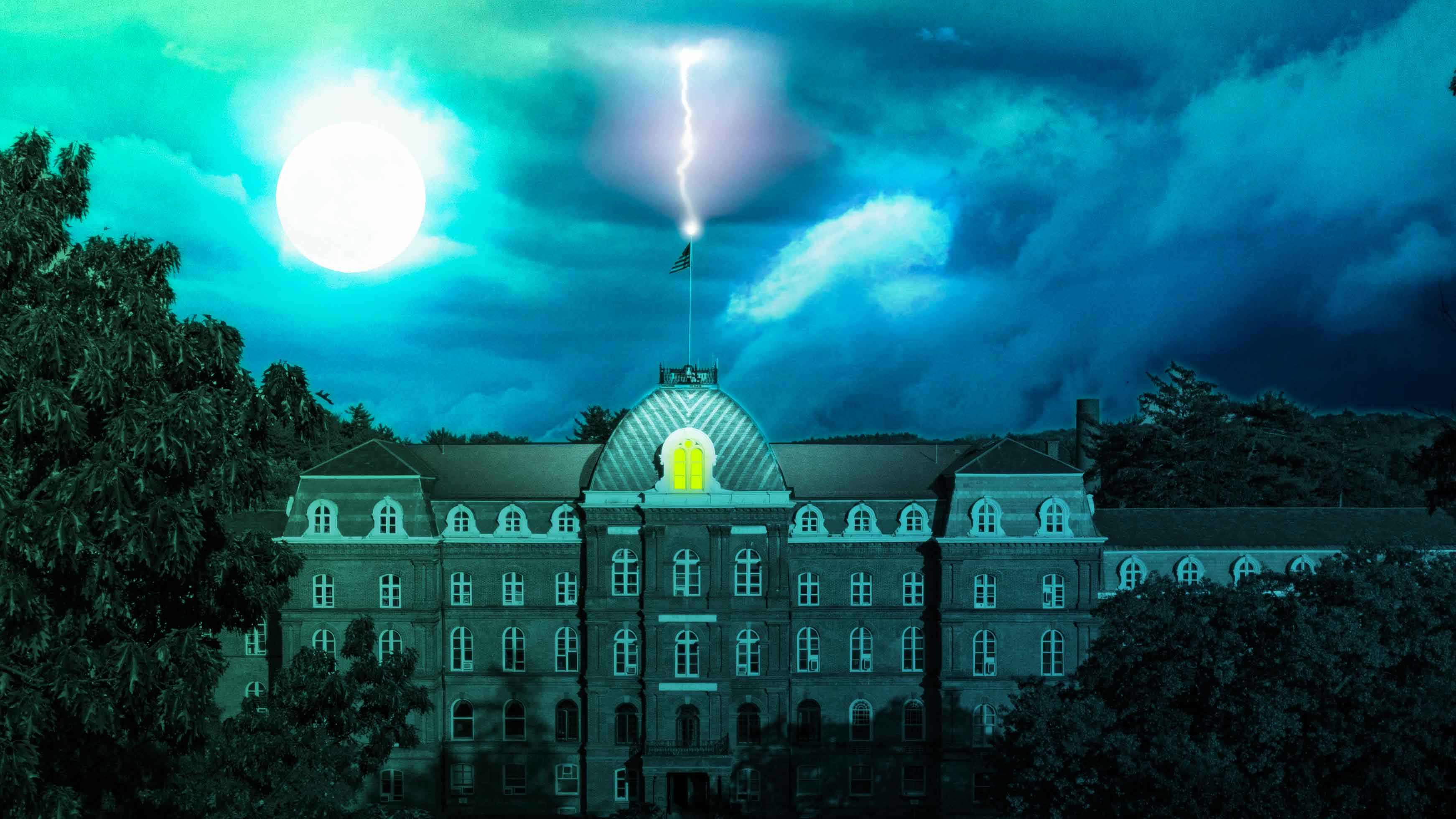Night time over Vassar College Main Building as lightning strikes the top of the building