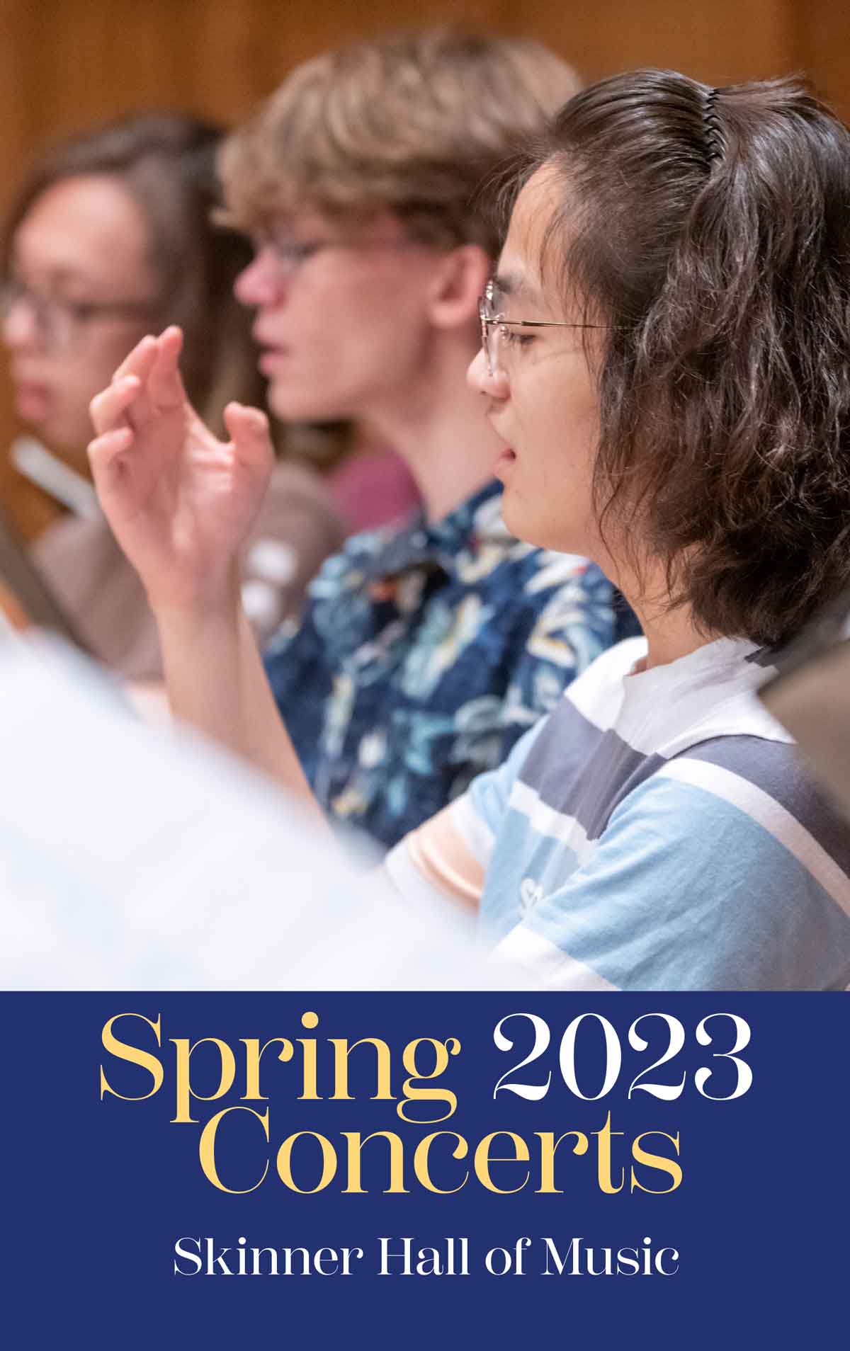 Image of singers in a choir with text below that reads Spring 2023 Concerts, Skinner Hall of Music