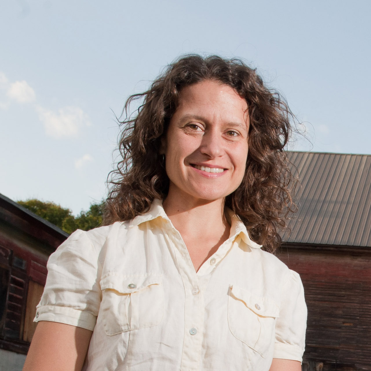 Woman standing outside in front of the Vassar Barns