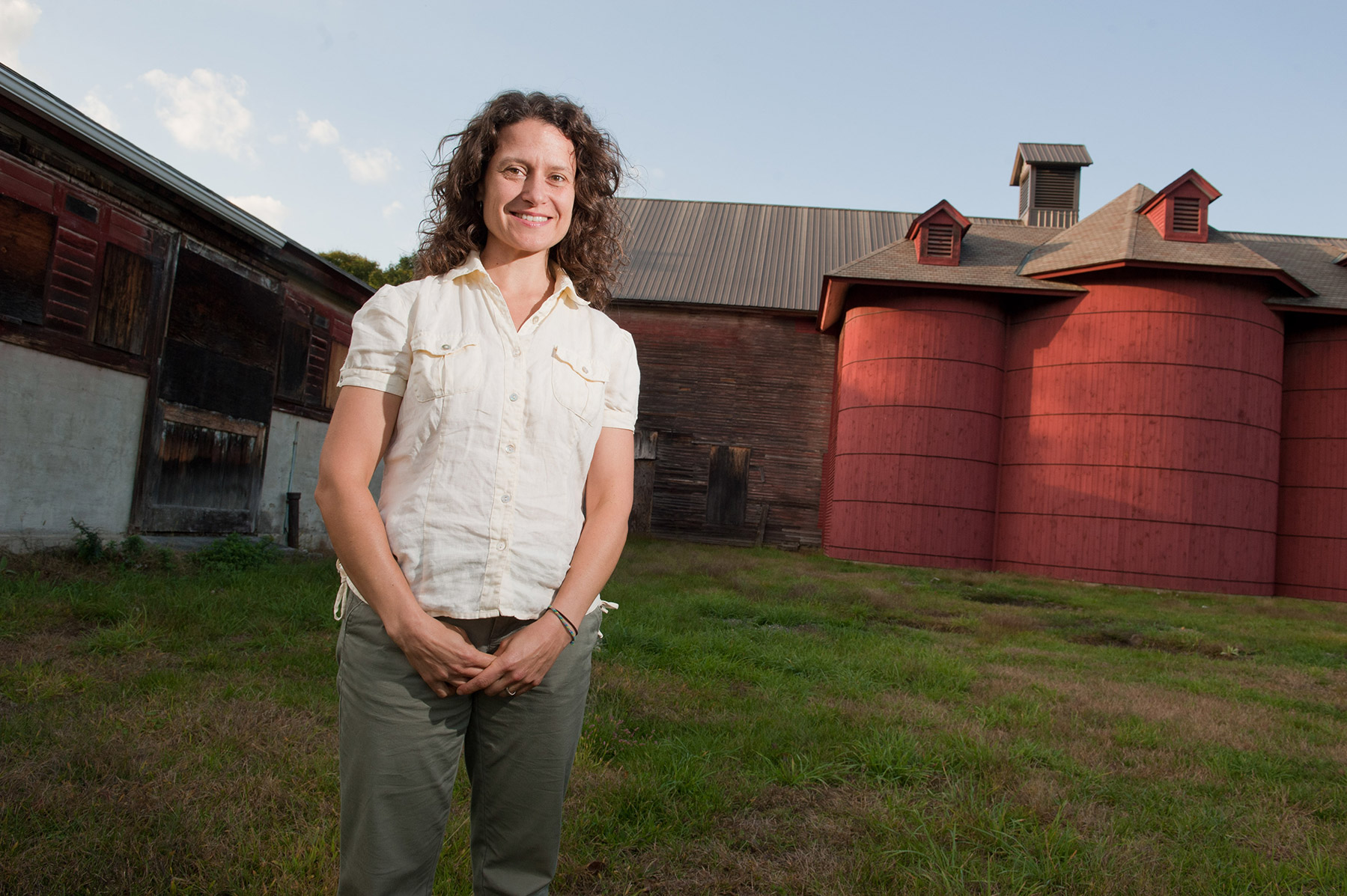 Woman standing outside in front of the Vassar Barns