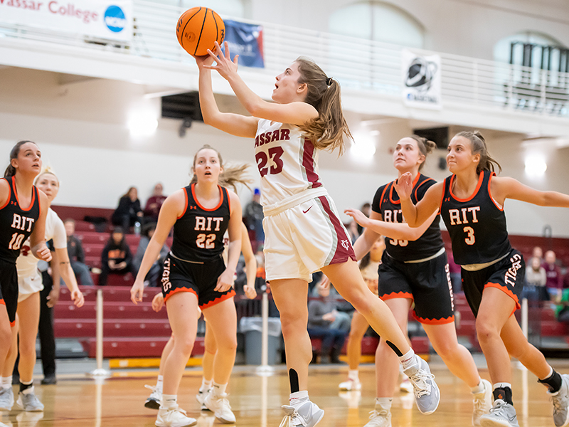 Julia Harvey jumps with the ball in her hands