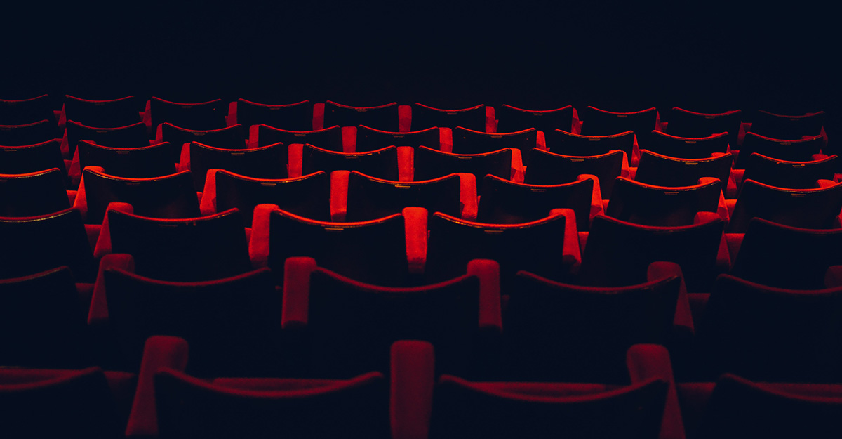 Red seats in rows in a movie theatre