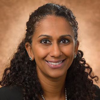Monica Fillmore wearing black shirt against a light background.