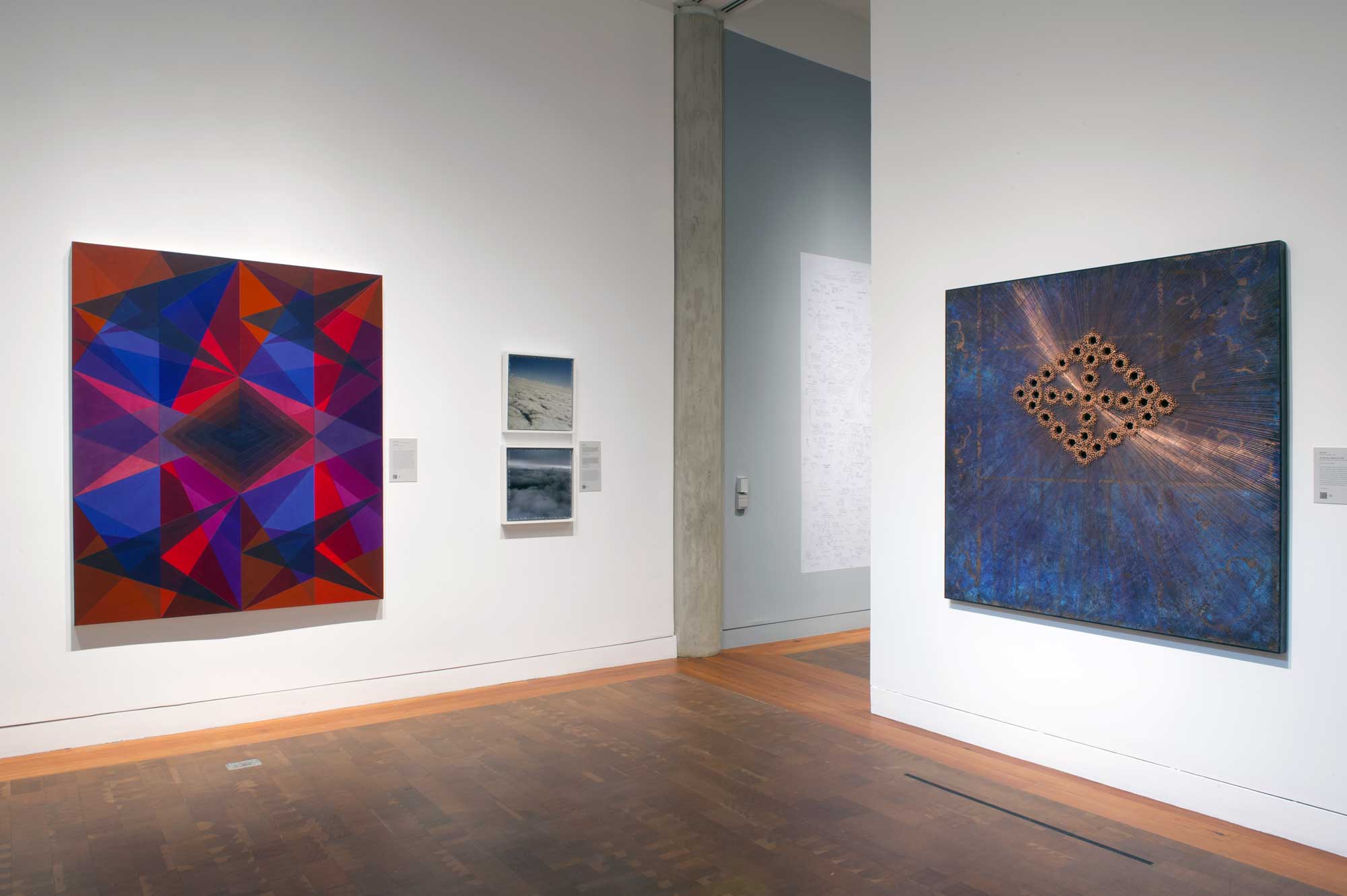 Artworks on two walls in a gallery